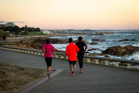 Three Runners on Boardwalk Stock Photos
