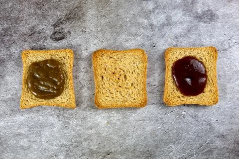 Three rusks slices lined different because with different jam Stock Photos