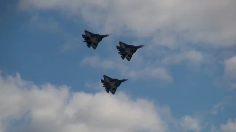 Three Russian aircraft of fifth generation Su-57 perform group flight. Stock Footage 118647586