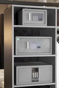 Three Safety Boxes Three Strong Safety Deposit Boxes in Shelf Copyright: x... Stock Photos