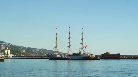 A three-sailing ship is sailing to the port in Yalta 4k Stock Footage 113879658
