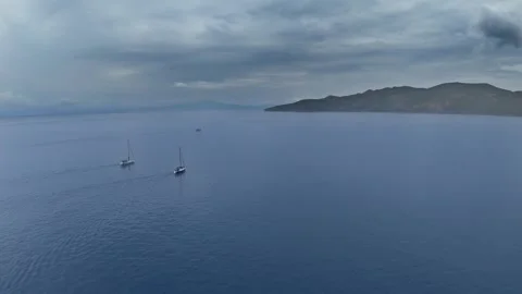 Three Sailing Yachts on Calm Sea Before Storm Stock Footage 336706388