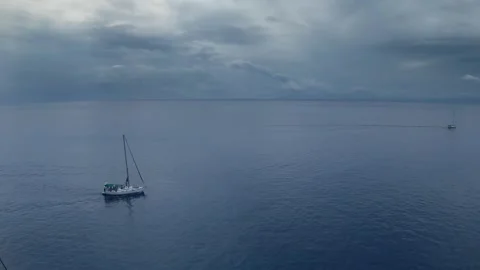 Three Sailing Yachts Under Storm Clouds in Greece Stock Footage 336706148