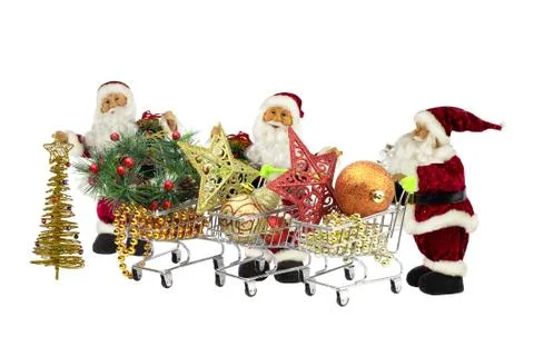 Three Santa Claus with baskets full of Christmas decorations and gifts on a w Stock Photos