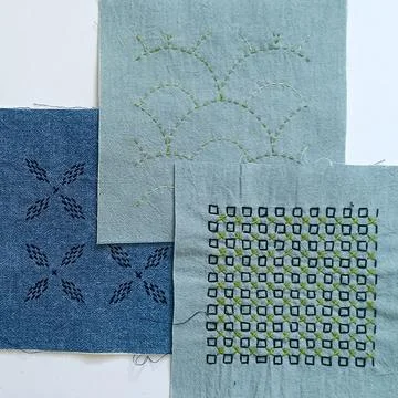 Three sashiko embroidery textile samples close-up Stock Photos