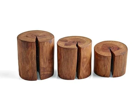 Three sawed tree trunks with a crack isolated on a white background. Podium.. Stock Photos