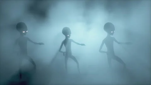 Three scary gray aliens dancing on a dark smoky background. UFO futuristic conce Stock Footage 304540345