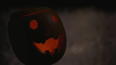 Three scary pumpkins at river bokhe in the dark Halloween party Stock Footage 97486442
