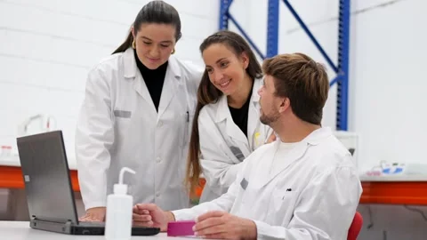 Three scientists talking in a laboratory Stock Footage 255196225