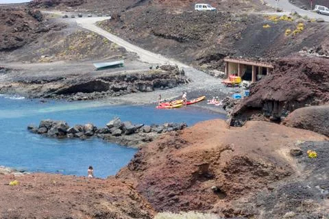 Three sea kayaks in the Atlantic ocean. Tourists kayaking with oars along the Stock Photos