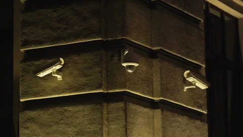 Three security cameras are fixed on building facade Stock Footage 271161514