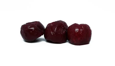 Three seedless cherries Stock Photos