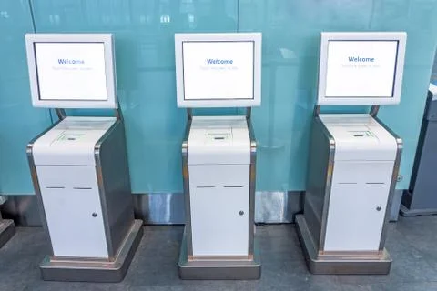 Three self check-in counters for a flight located in the airport passenger te 스톡 사진