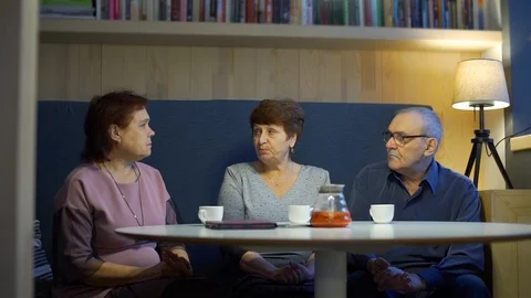 Three Senior Friends Talking about Life in Cafe Vídeos de archivo 123644074