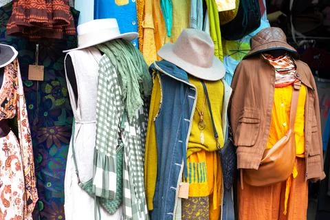 Three sets of clothes for the fall. Multi-layered clothes hanging on hangers Stockfoto's