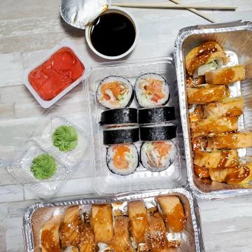 Three sets of delicious rolls home delivery on an isolated background Stock Photos