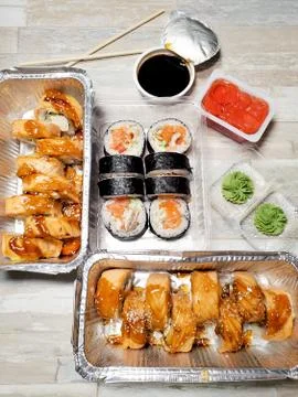 Three sets of delicious rolls home delivery on an isolated background Stock Photos