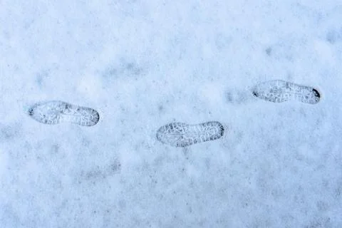 Three sets of footprints in the snow Stock Photos