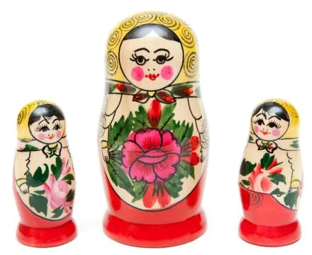 Three sets of nesting dolls stand Stock Photos