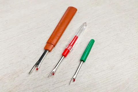 Three sewing tool thread pins to open wrong stitches Stock Photos
