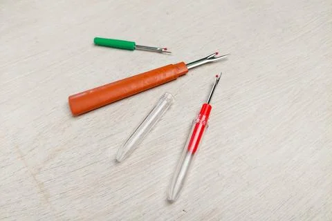 Three sewing tool thread pins to open wrong stitches Stock Photos