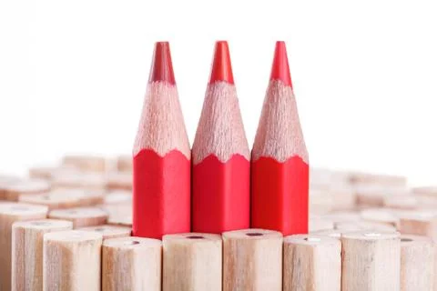 Three sharpened red pencil among many ones Stock Photos