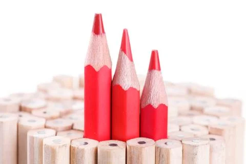 Three sharpened red pencil among many ones Stock Photos