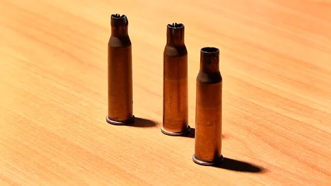 Three shells from a Russian rifle on the table Stock Footage 72848208