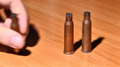 Three shells from a Russian rifle on the table Stock-Footage 72848318