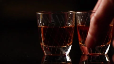Three shots of schnaps beeing fetched quick Stock Footage 147559516