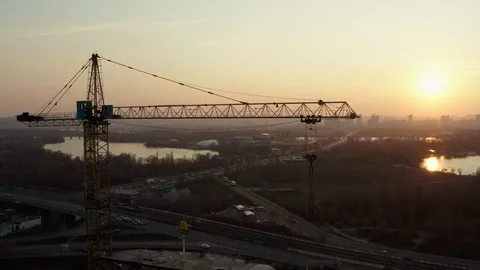Three shots urban construction and crane silhouette landscape at sunset Stock Footage 127947148