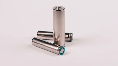 Three silver AA and AAA batteries isolated on white. Side view Stock Footage 237694103