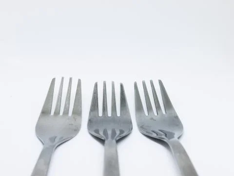 Three Silver Forks on White Foto stock