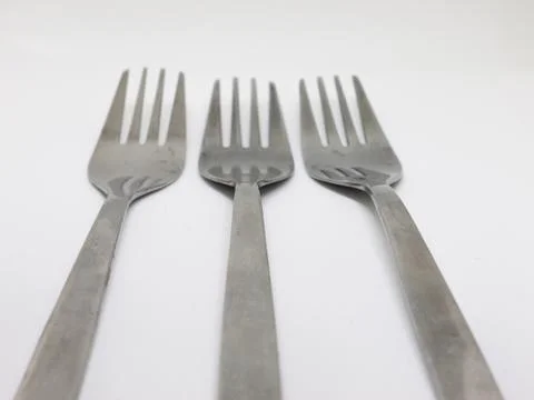 Three Silver Forks on White Stock Photos