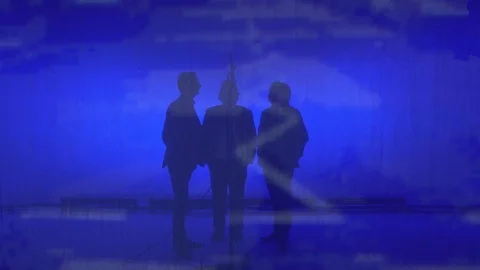 Three singers silhouetted together singing on stage Stock Footage 112333047