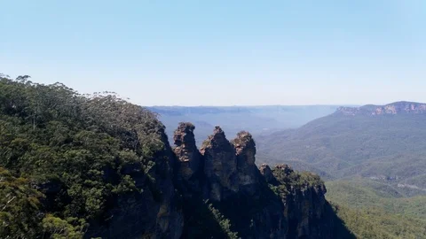 Three sisters cliffs in Katoomba, Scenic Pan view of a forest and hills, in b Stock Footage 86705652