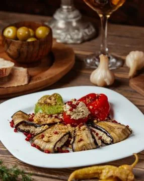 Three sisters dolma stuffed vegetables with minced meat in white plate Stock Photos