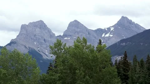 Three Sister’s Mountains Canmore Still Shot with Trees Infront Stock Footage 144386889