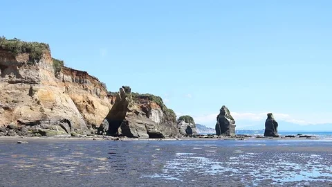 Three sisters rock formation elephant new plymouth low tide Stock Footage 98085822