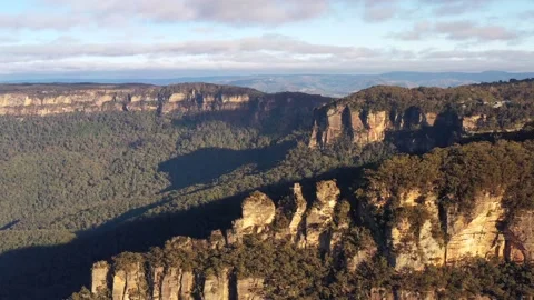 Three sisters rock formation peaks in Katoomba town, Australia 4k aerial. Stock Footage 156793845