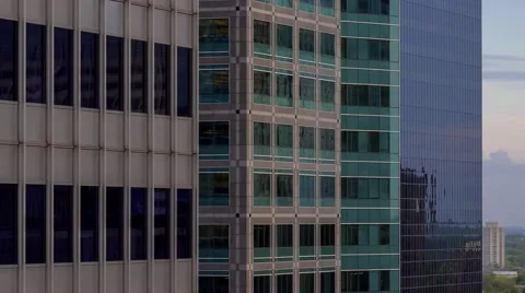 Three Skyscraper Facades at Dusk Stock Footage 65322275