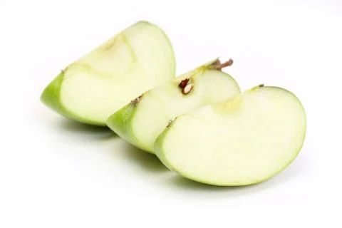 Three slice a green apple Stock Photos