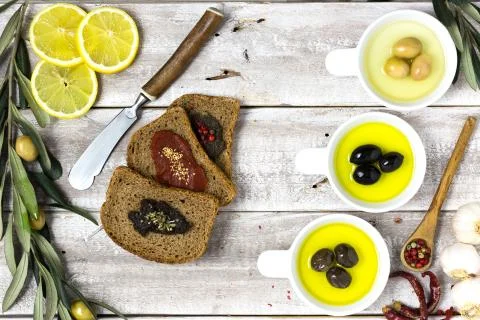 Three slices of bread and olives flat lay Stock Photos