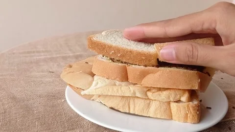 Three slices of bread with chocolate sprinkles Stock Footage 146256630