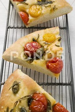 Three Slices Of Pizza With Cherry Tomatoes, Capers & Rosemary