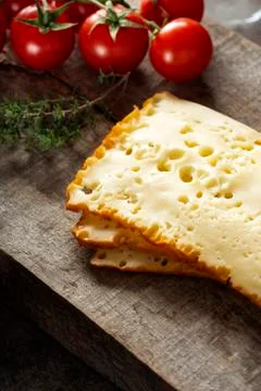 Three slices of scheiben cheese with tomatoes Stock Photos
