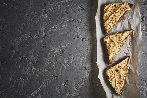 Three slices of whole wheat bread with hummus on the grey concrete backdrop Stock Photos