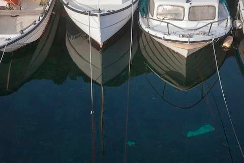 Three small boats Stock Photos