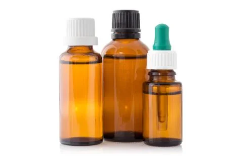 Three small bottles with medicinal solution Stock Photos