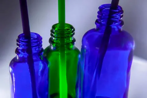 Three small bottles with straws Stock Photos